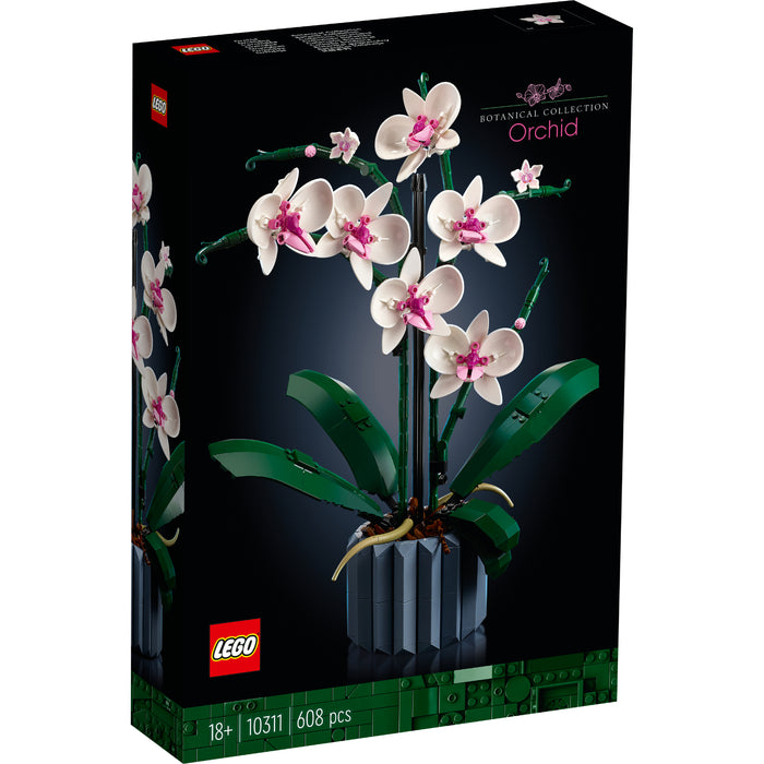 Modelo LEGO Orchid 10311 con flores blancas y rosas en jarrón azul decorativo